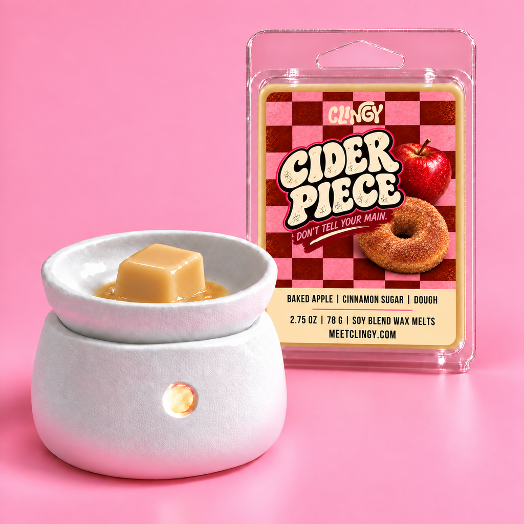 Cider Piece caramel-tan wax melt cube in a white warmer