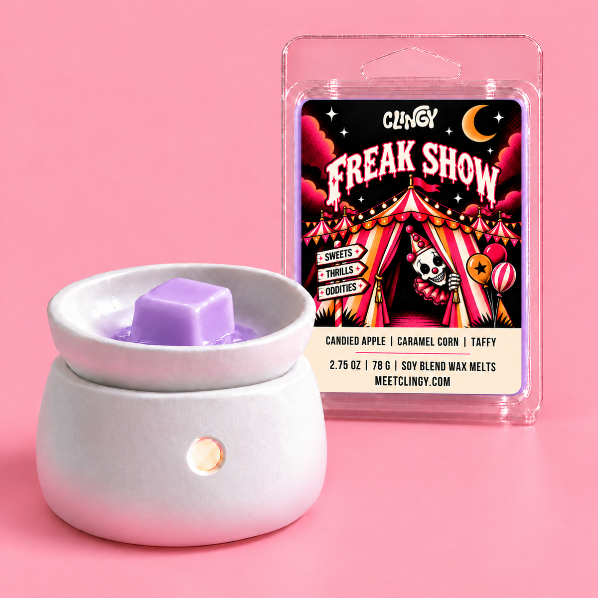 Freak Show lavender wax melt beside a white ceramic warmer