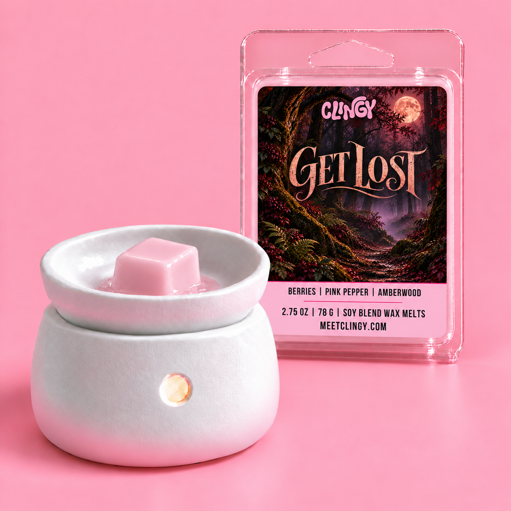Get Lost light pink wax melt cube in a warmer