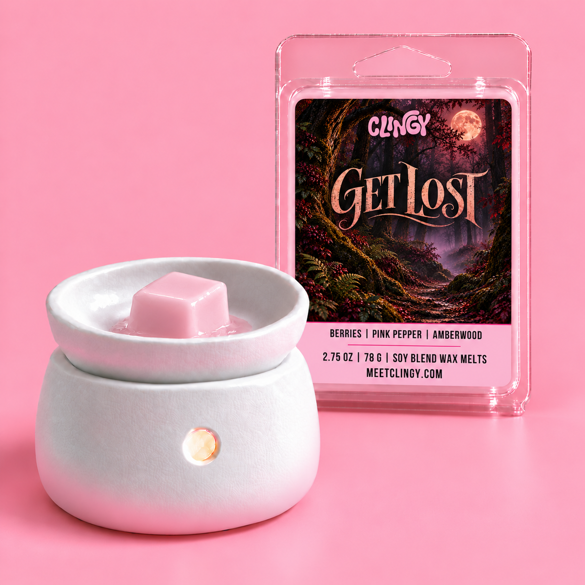 Get Lost light pink wax melt cube in a warmer
