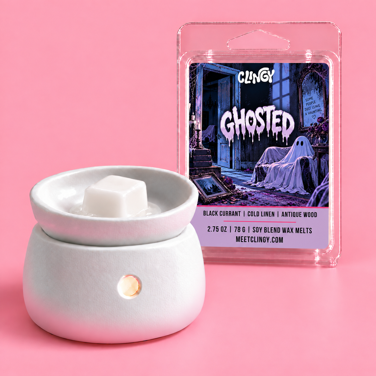 Ghosted white wax melt beside a white ceramic warmer