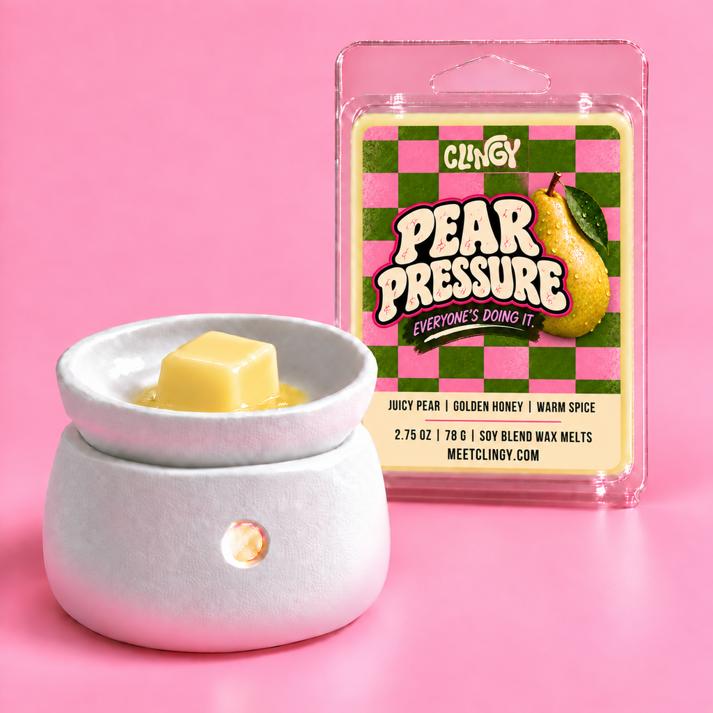 Pear Pressure light yellow wax melt cube in a white warmer