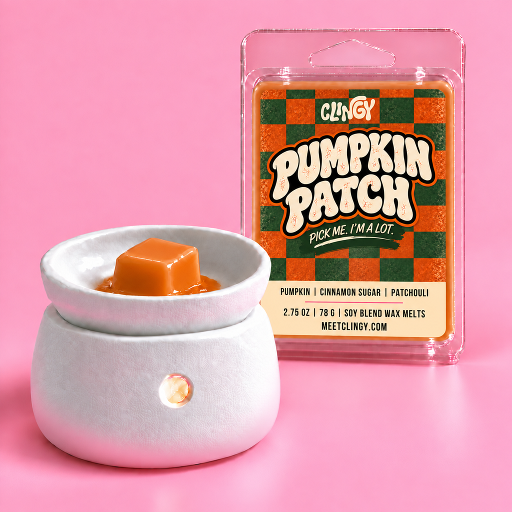 Pumpkin Patch orange wax melt shown in a white wax warmer