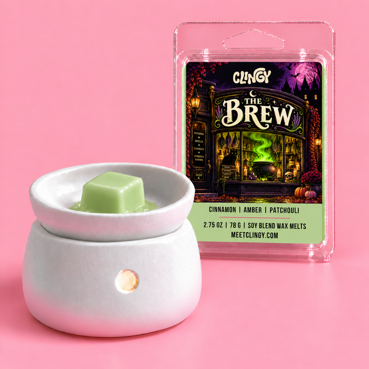 The Brew sage green wax melt beside a white ceramic warmer